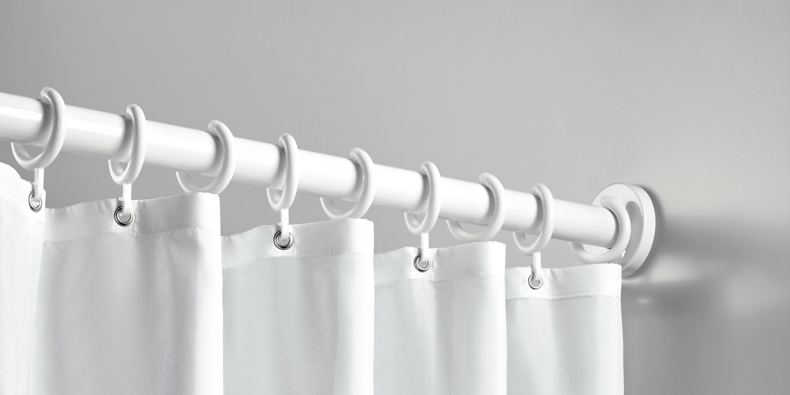 Shower curtain on a shower rail white