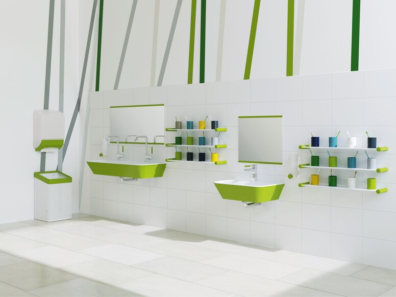 Child-friendly washbasin with green accents; two washbasins at different heights next to colorful toothbrush cup holders