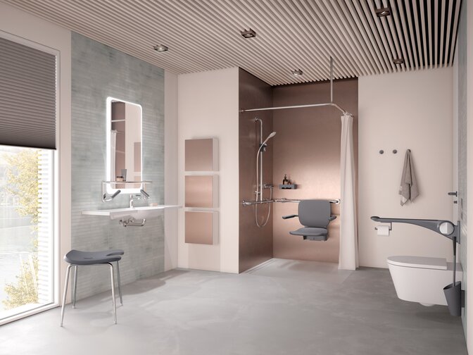 Salle de bain de soins sans barrière avec lavabo, espace douche et WC